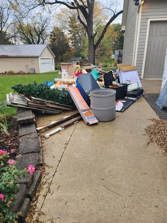 Dumpster being loaded with debris for 3 Yard Dumpster Rental in Terrace Heights
